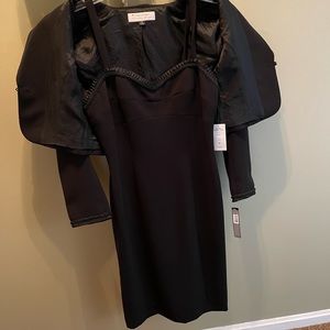 Brand new with tags elegant black dress.
